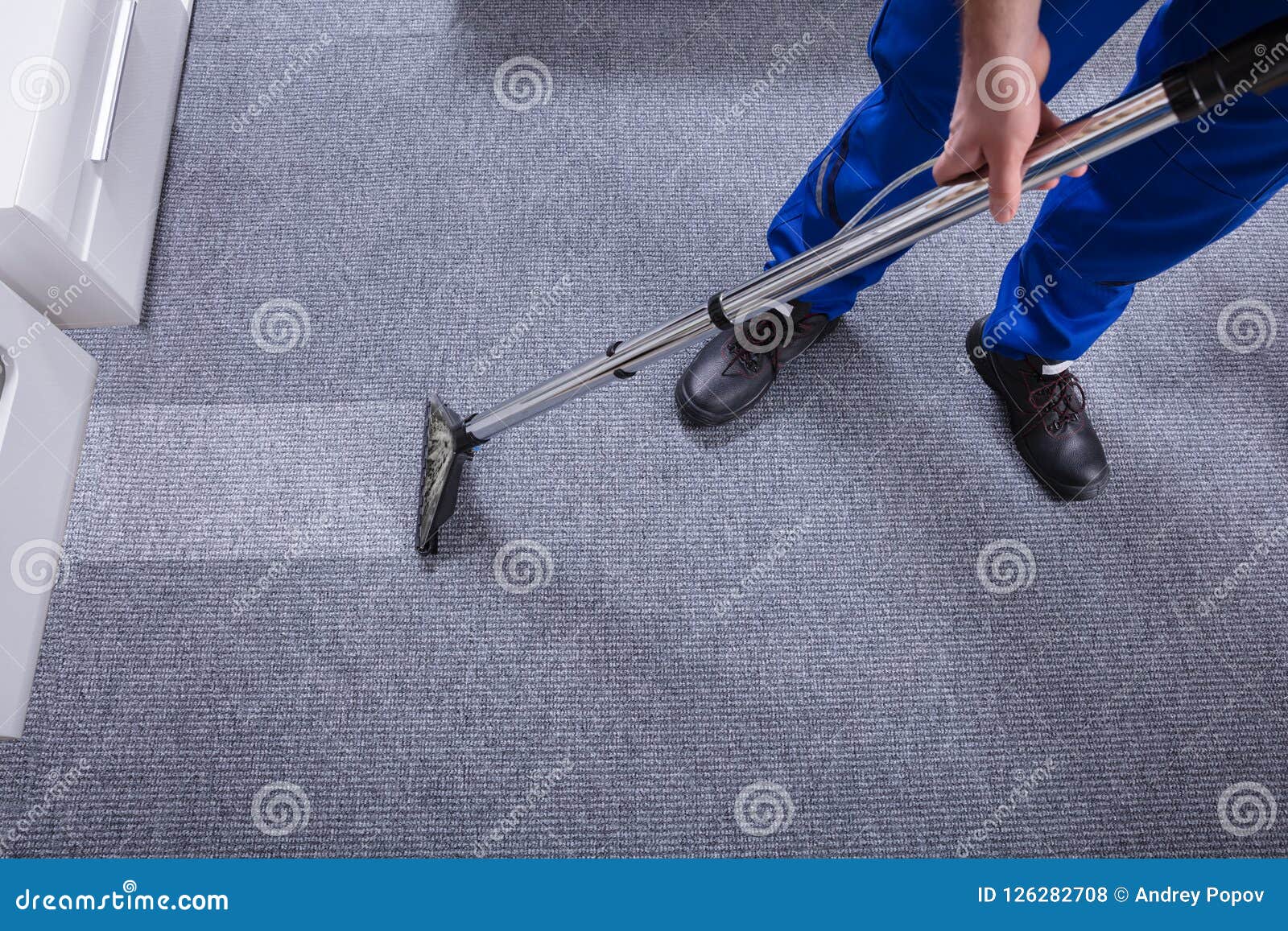 janitor cleaning carpet