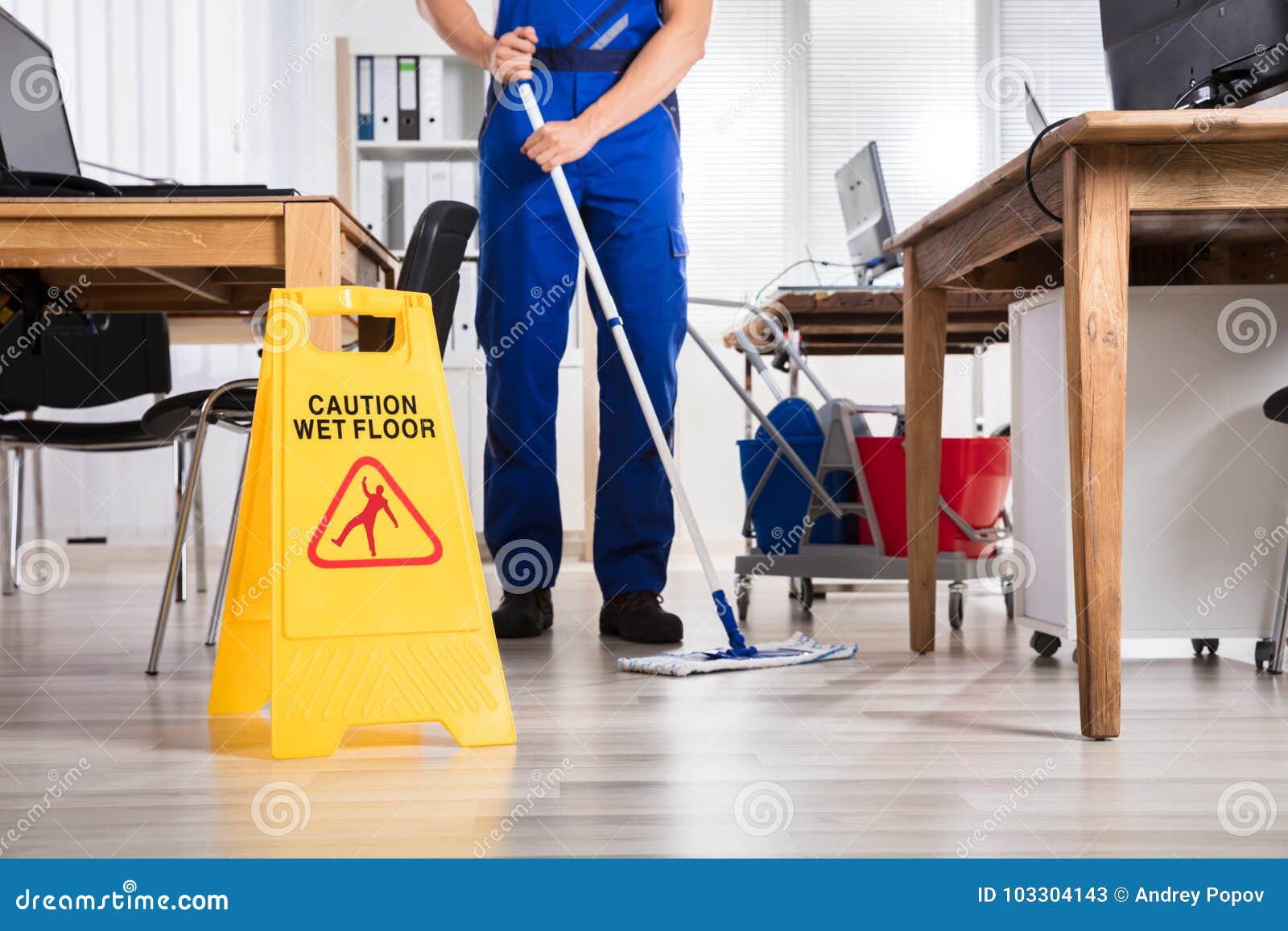 janitor cleaning floor in office