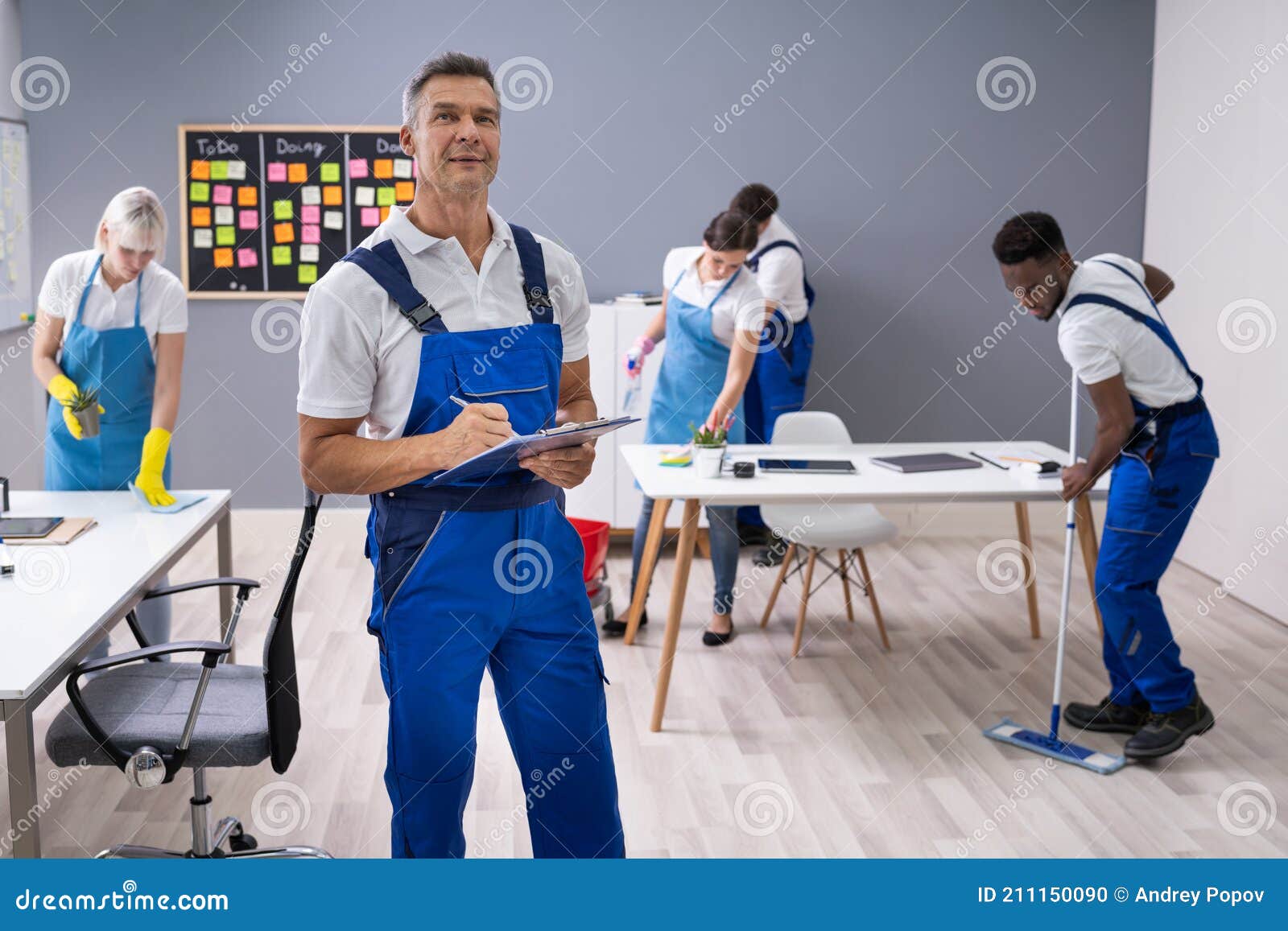 Janitor with His Team in Office Stock Photo Image of american