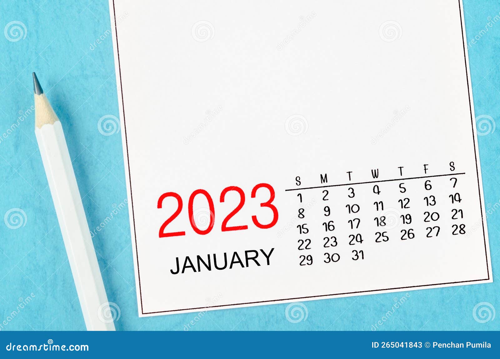 The January 2023 Monthly Desk Calendar for 2023 with Pencil on Blue
