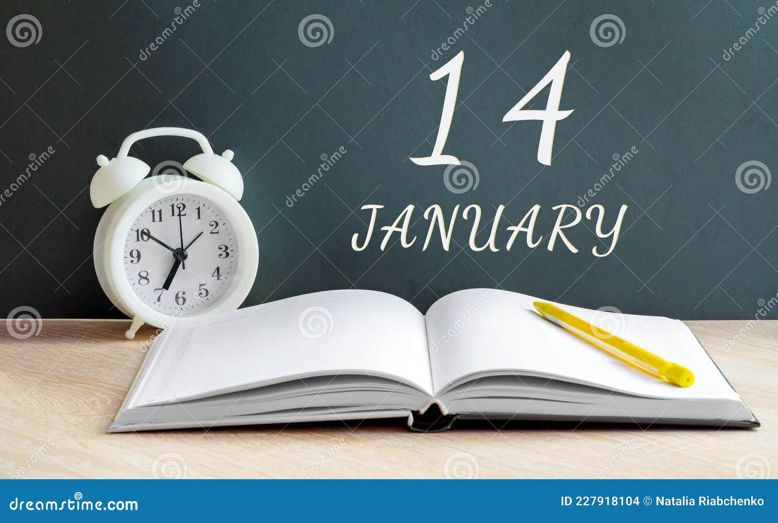 january 14. 14-th day of the month, calendar date.a white alarm clock, an open notebook with blank pages, and a yellow
