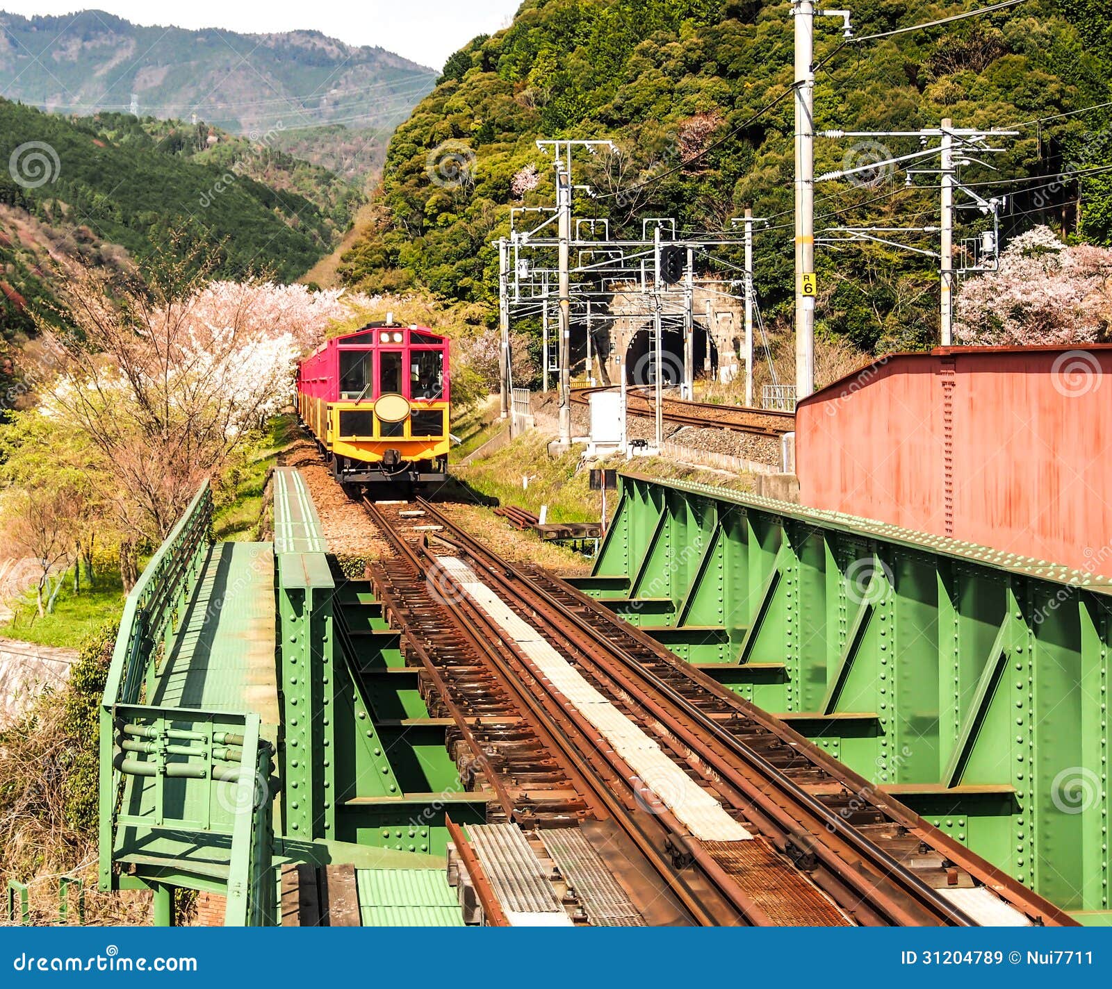 Japan scenic train, Kyoto, Japan 1. Japan scenic train with sakura blossom at Arashiyama, Kyoto, Japan