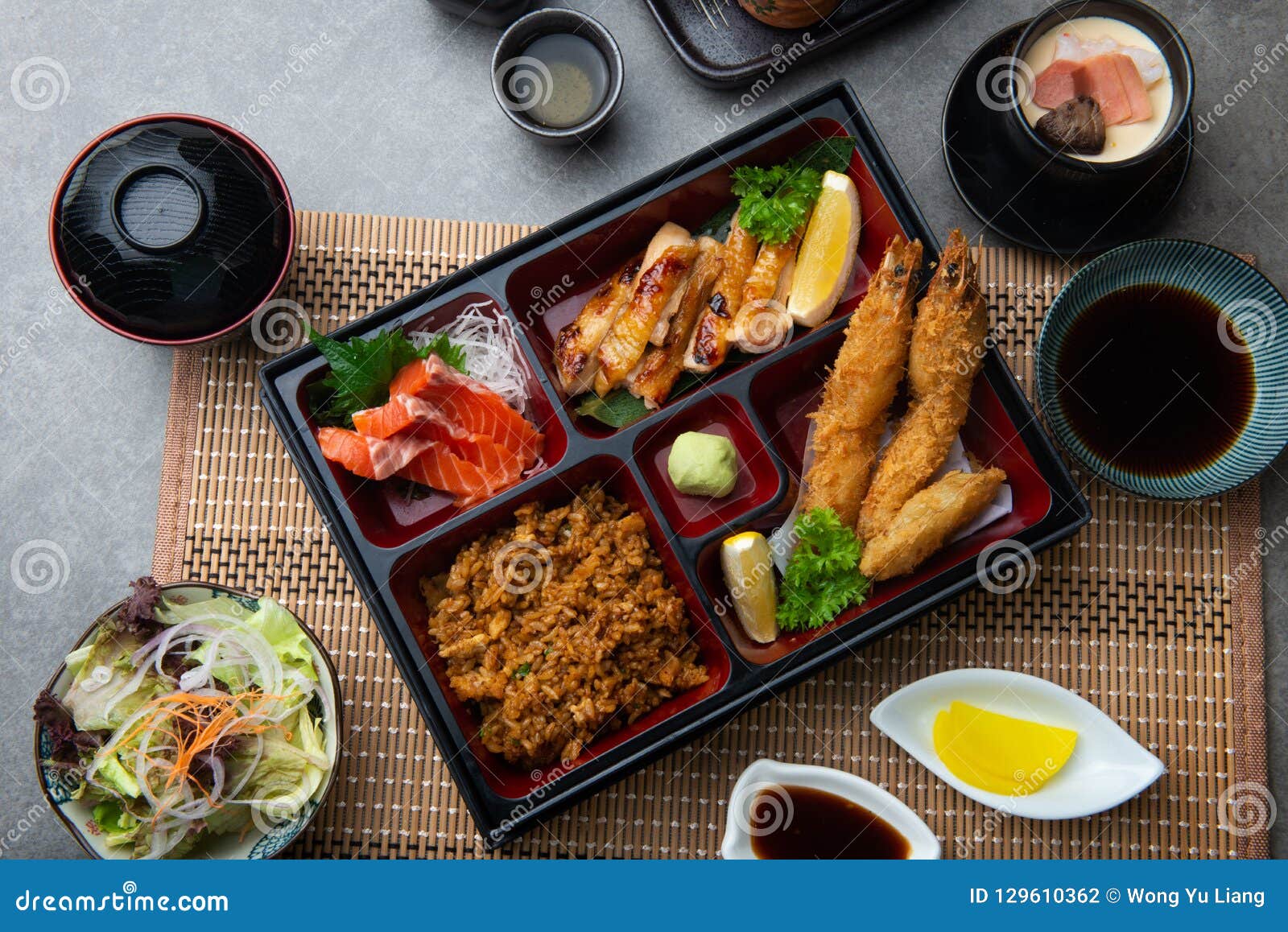 Japanese bento set with dark background.