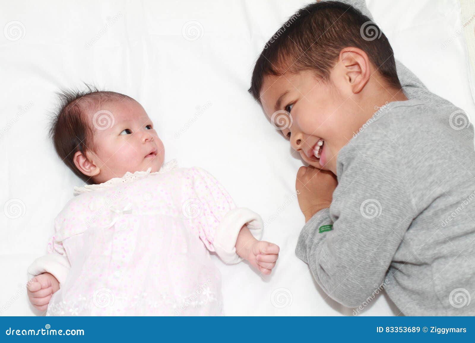 Japanese Sisters Using Younger Brother