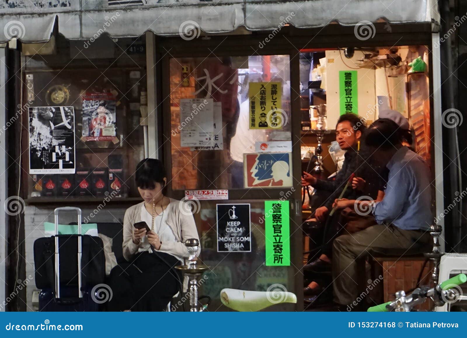 Japanese Of Different Ages Smoking Hookah. Shisha Bar Near ...