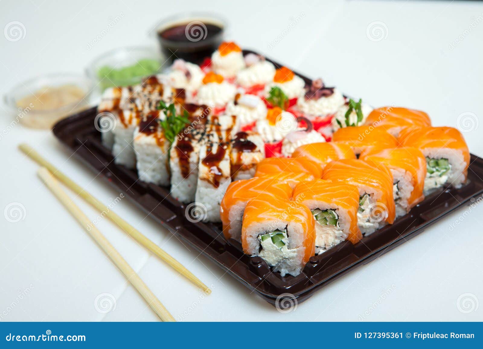 Japanese Food Rolls In Plastic Box. Sushi Set In A Plastic ...