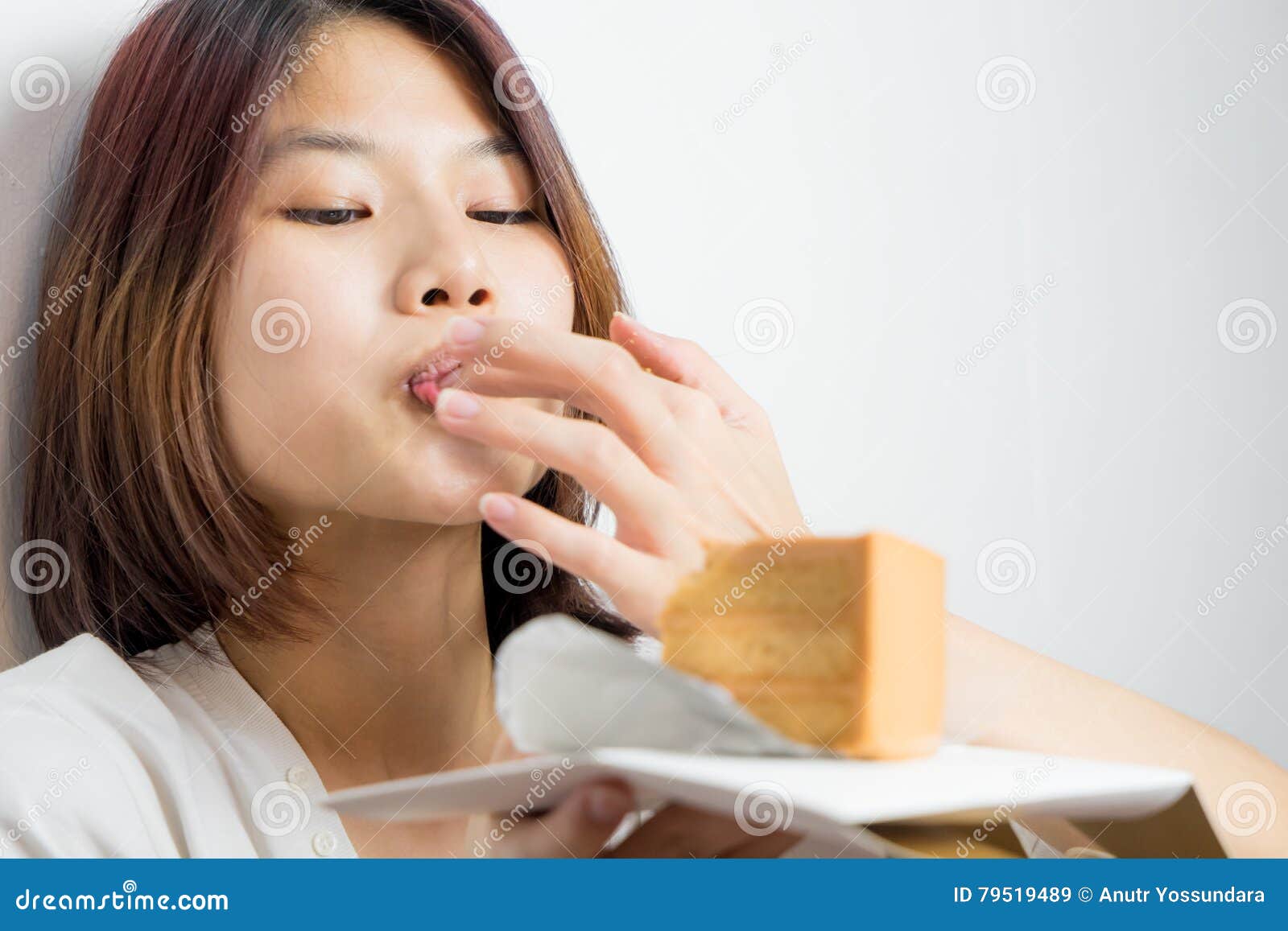 Japanese Girl Is Deeply Enjoying By Lick The Cake Stock Image Image