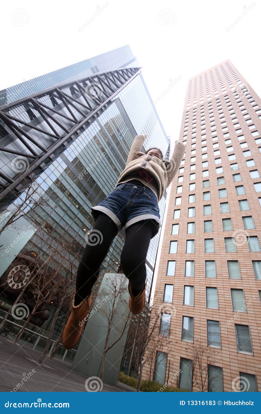 Japanese Girl Jumping in Front of Skyscrapers Stock Image Image of