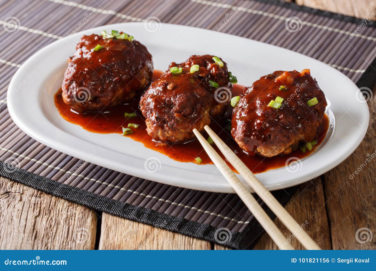 Japanese Hambagu Steak with Sauce Close-up on a White Plate. Horizontal ...