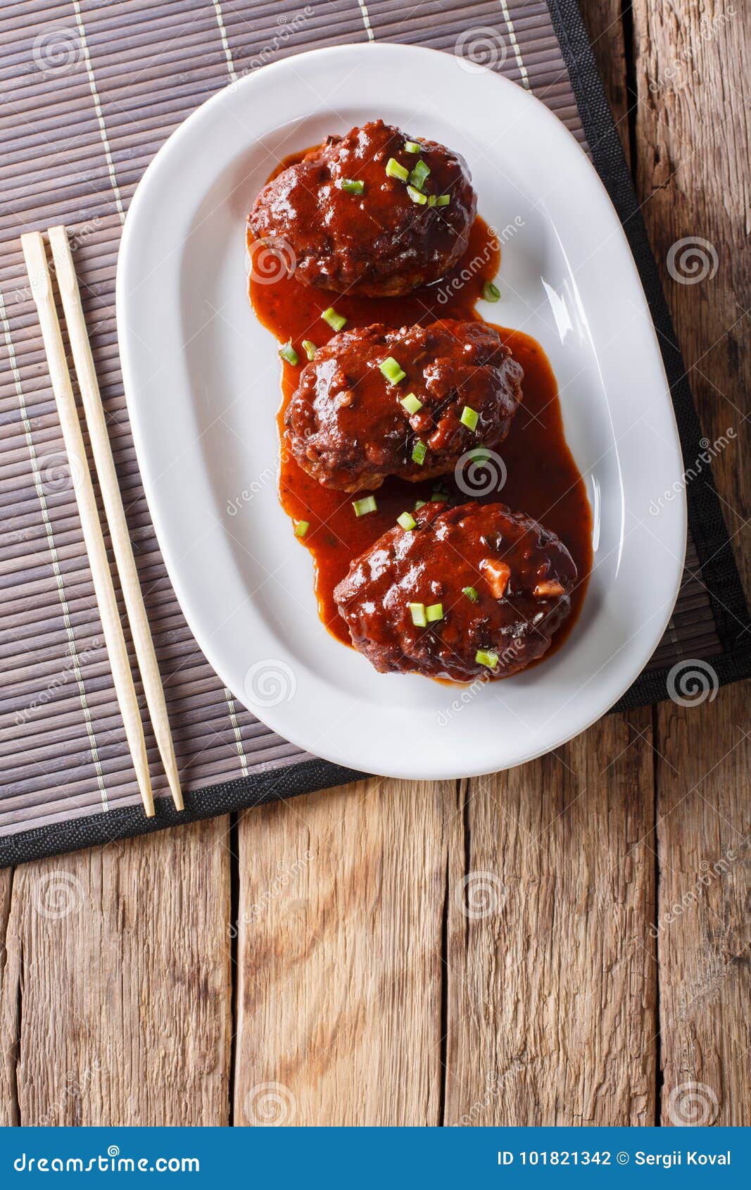 Japanese Hambagu Steak with Sauce Close-up on a White Plate. Vertical ...