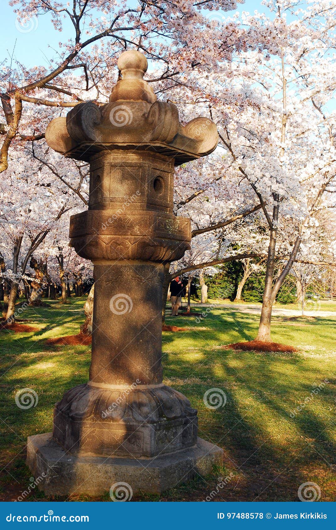 Japanese Lantern Statues Isolated On A Rock In The Middle Of A Pond