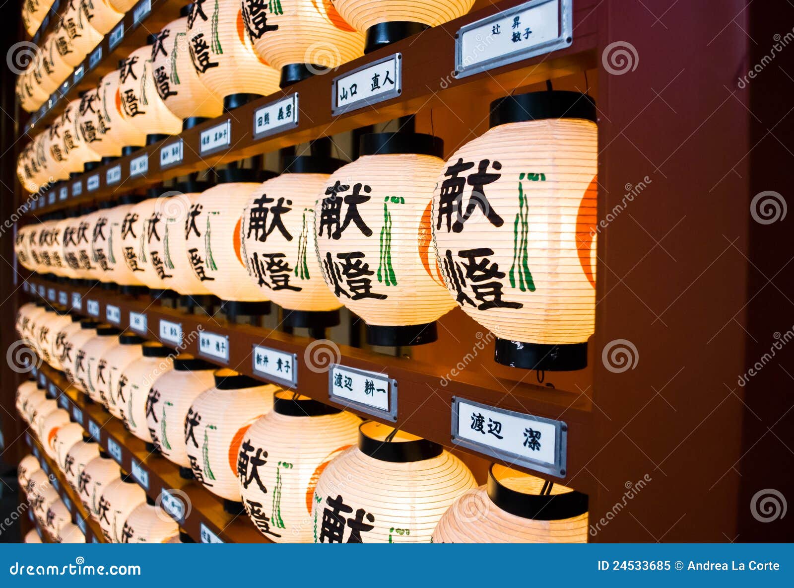 Japanese Lantern Statues Isolated On A Rock In The Middle Of A Pond