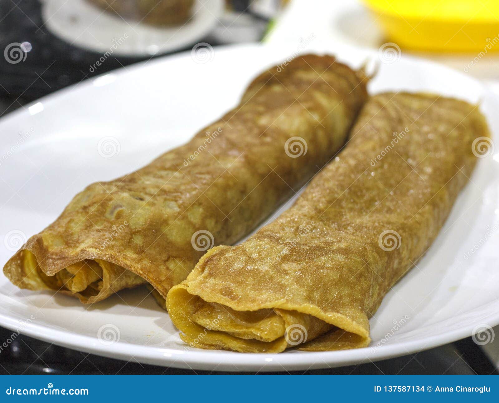 Japanese Omelette, Roll of Fried Eggs on White Plate Stock Photo