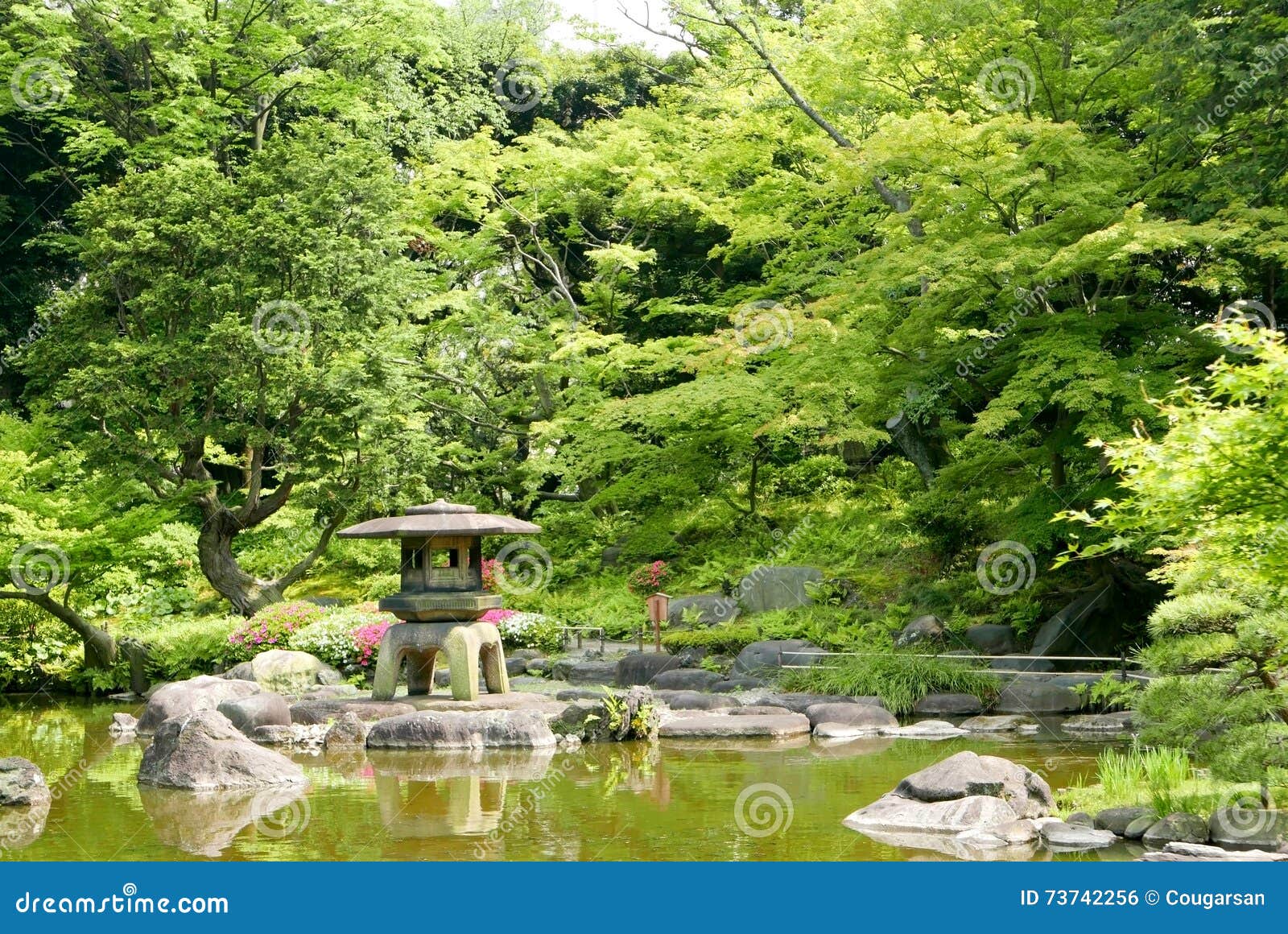 Japanese Outdoor Stone Lantern Green Plants In Zen Garden Stock