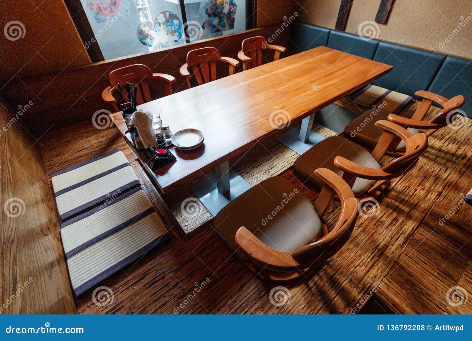 Japanese Style Ramen Restaurant Low Table In Center With Seats On