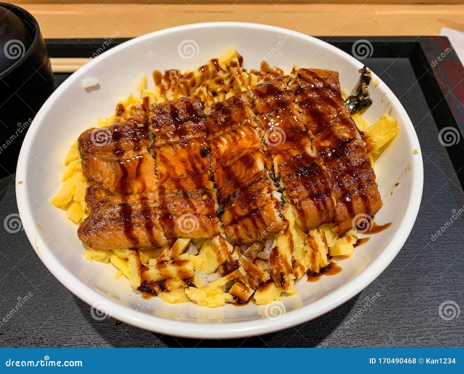 Japanese Unagi Don - Grilled Eel with Egg Over Rice Bowl Stock Photo