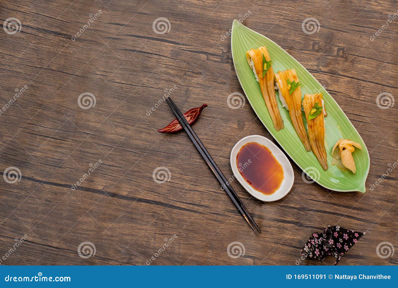 japanese unagi sushi on green plate wood table