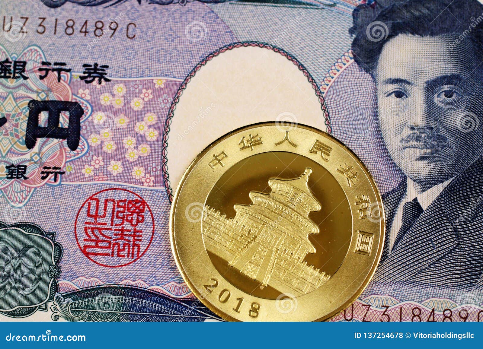A Japanese 1000 Yen Note With A New Chinese Panda Gold Coin Stock Photo a-japanese-1000-yen-note-with-a-new-chinese-panda-gold-coin-stock-photo