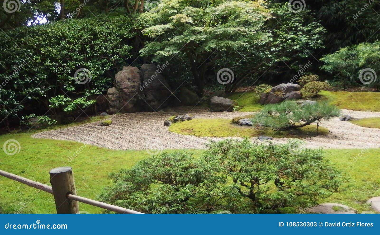 japanese zen garden with stones surrounded by grass