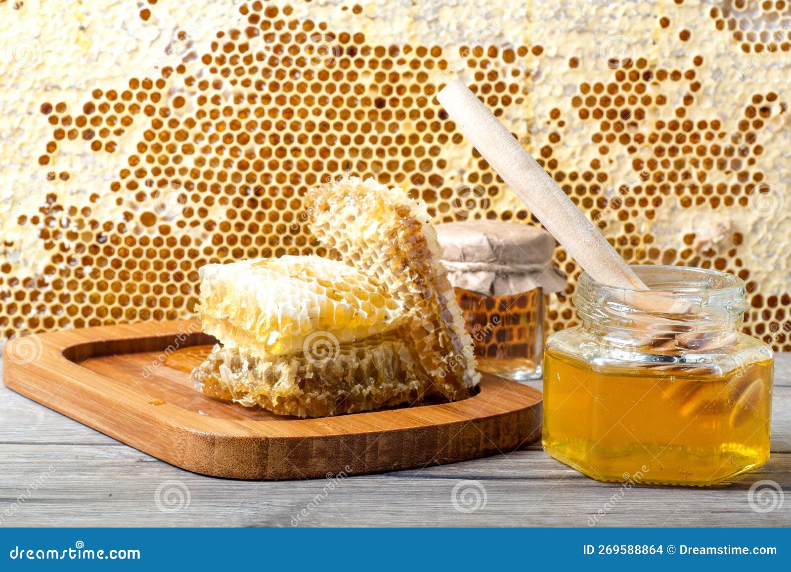 Jar of Fresh Honey and on Gray Table Near Frame with