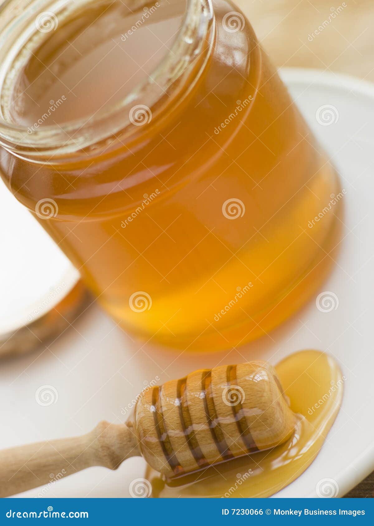 Jar of Honey and Spoon stock photo. Image of superfood 7230066