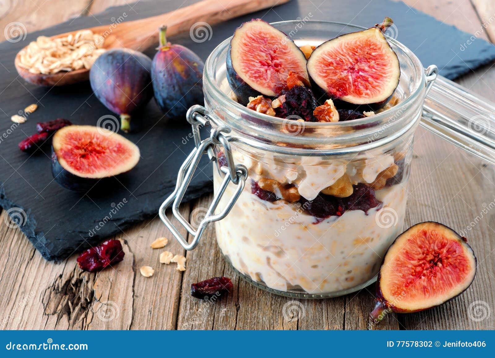 jar of overnight autumn oats with figs, cranberries and walnuts