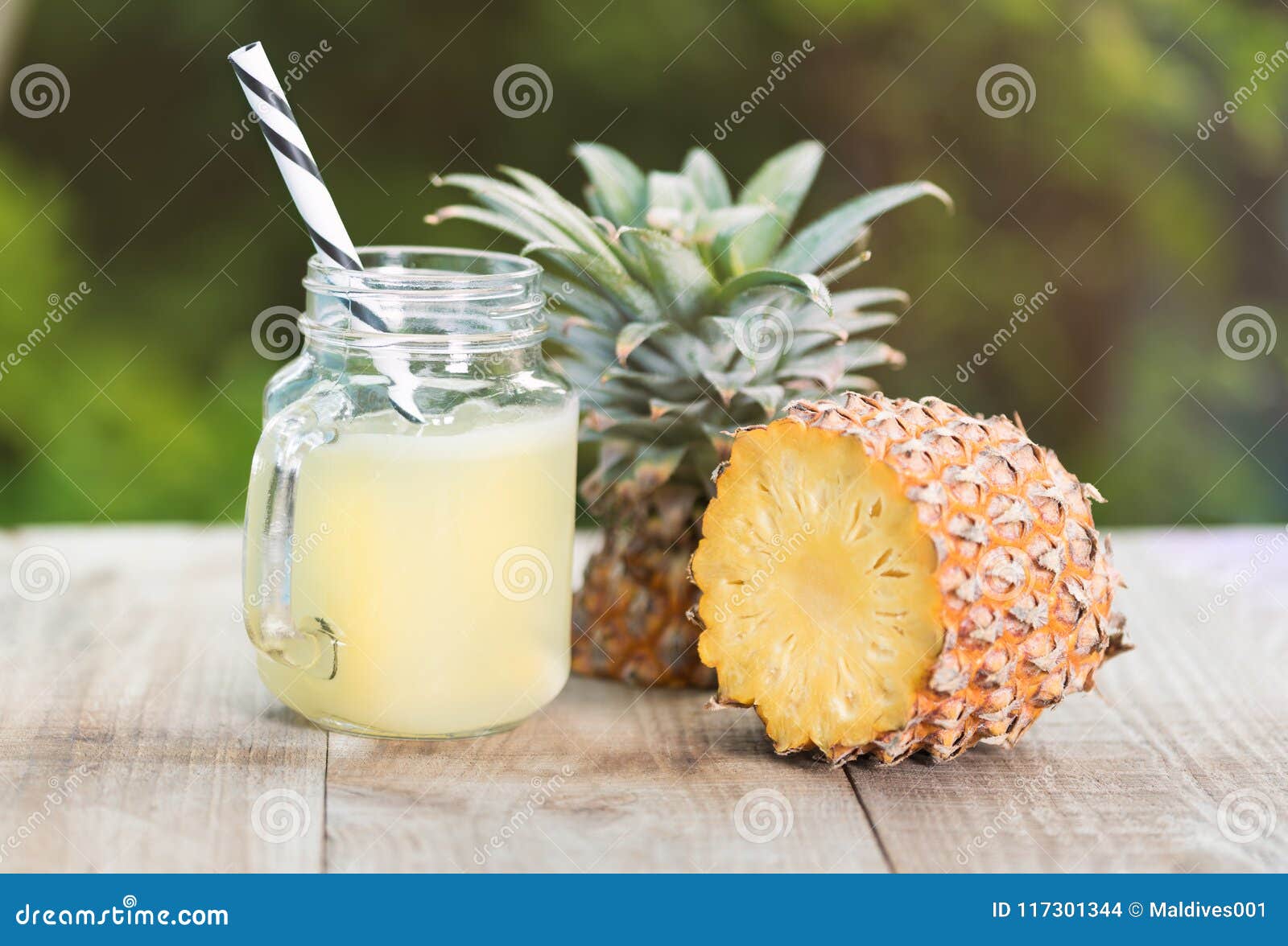 A Jar Of Pineapple Juice With A Raw Pine Apple Stock Photo Image of