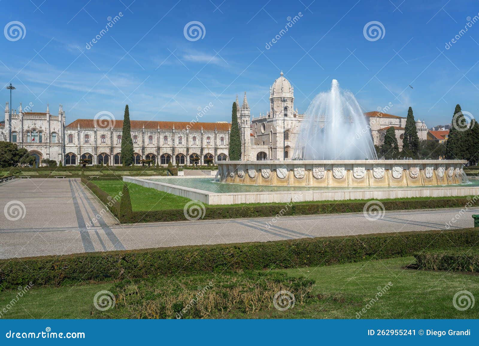jardim da praca do imperio square with fountain and jeronimos monastery - lisbon, portugal