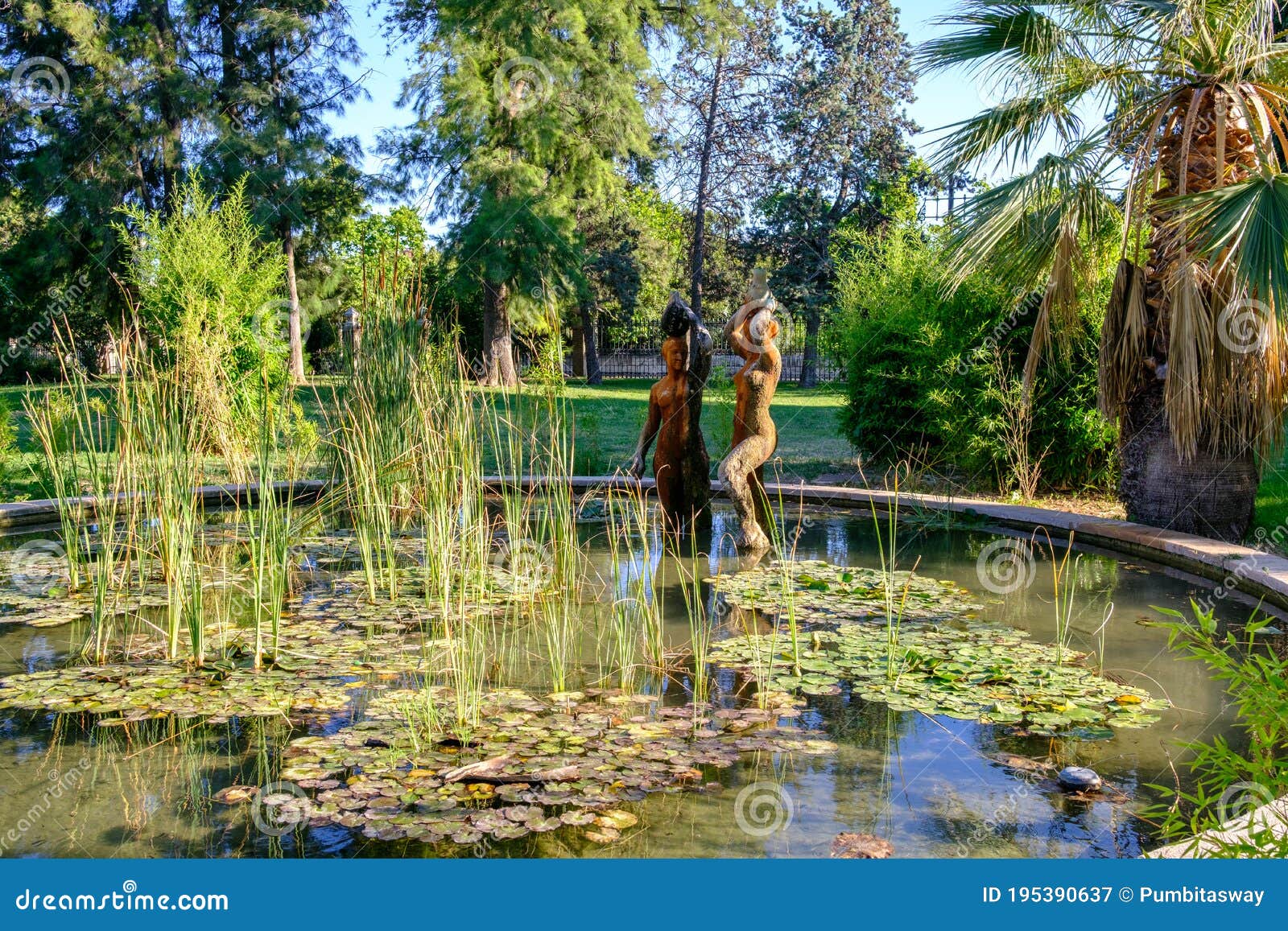 jardines del real, walk in-between trees - viveros valencia, near old dry riverbed of the river turia