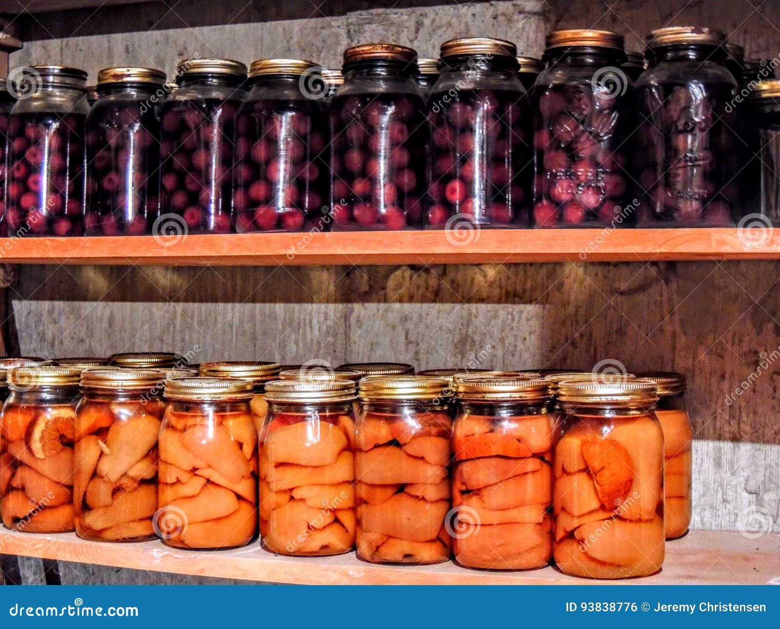 Jars of Canned Cherries and Peaches Lined in a Row Stock Photo Image