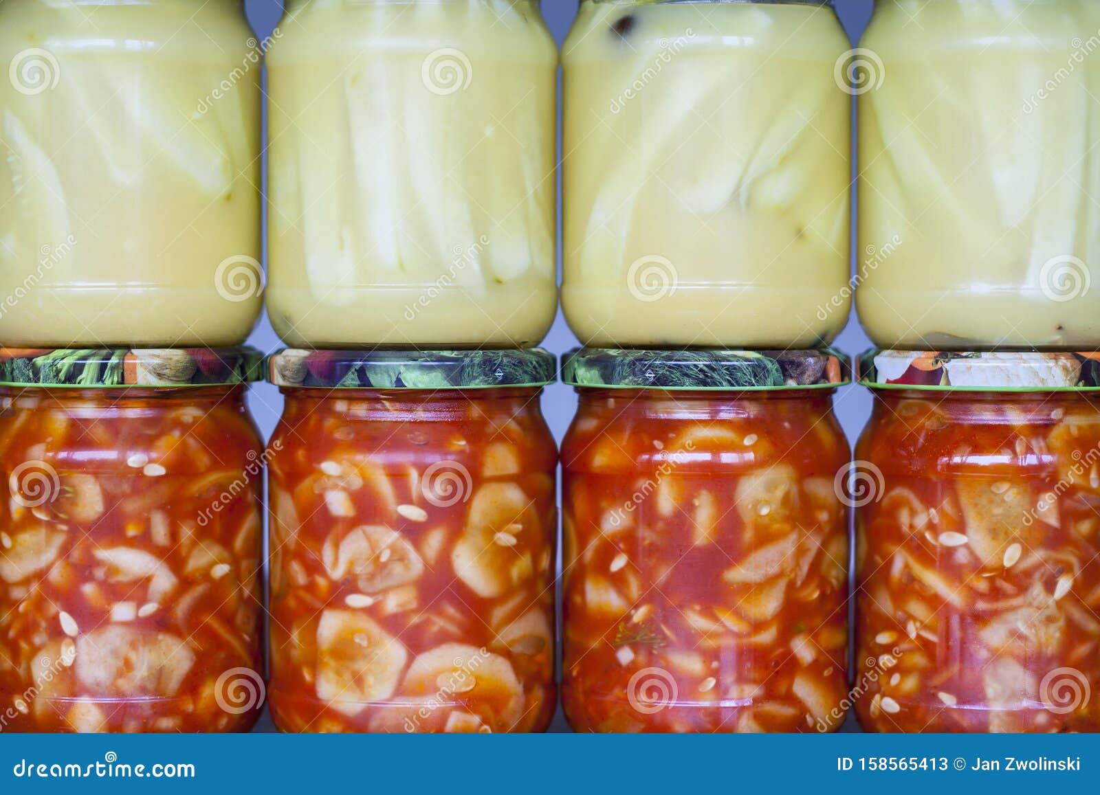 jars with cucumber preserves inside