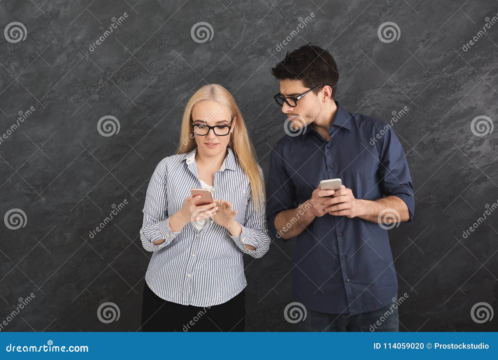 Jealous Boyfriend Watching Girl Texting on Phone Stock Photo Image of