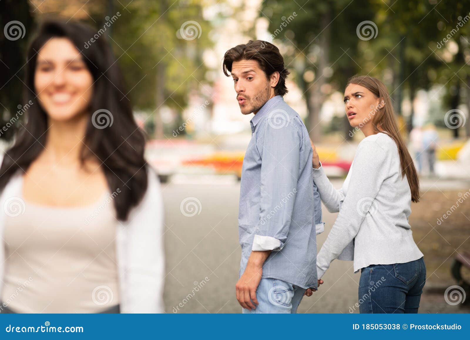 Jealous Girlfriend Being Suspicious Indoor Shot Of Beautiful Curly Haired Caucasian Girl