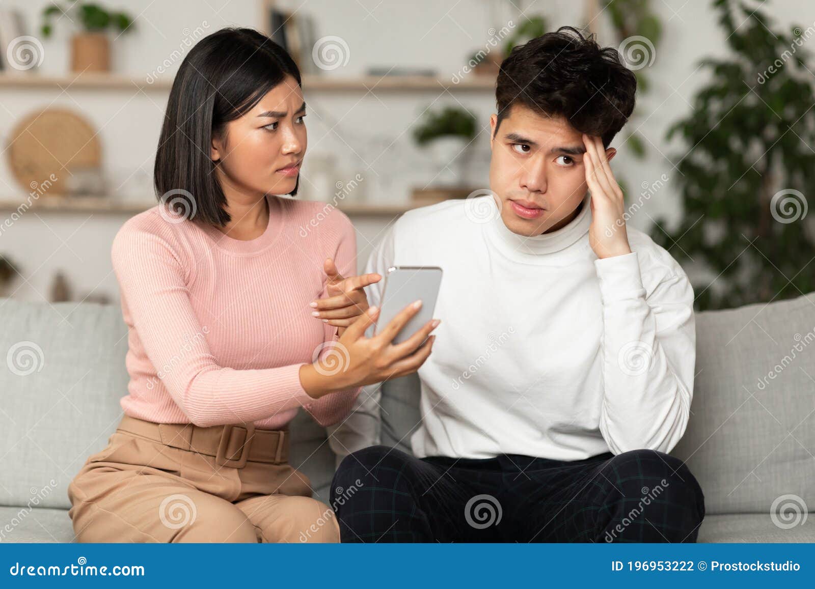 Jealous Korean Wife Showing Cheating Husband His Smartphone at Home