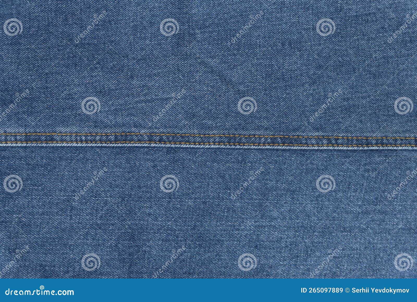 Jean Fabric with Brown Stitching Seam in Middle. Texture Blue Denim