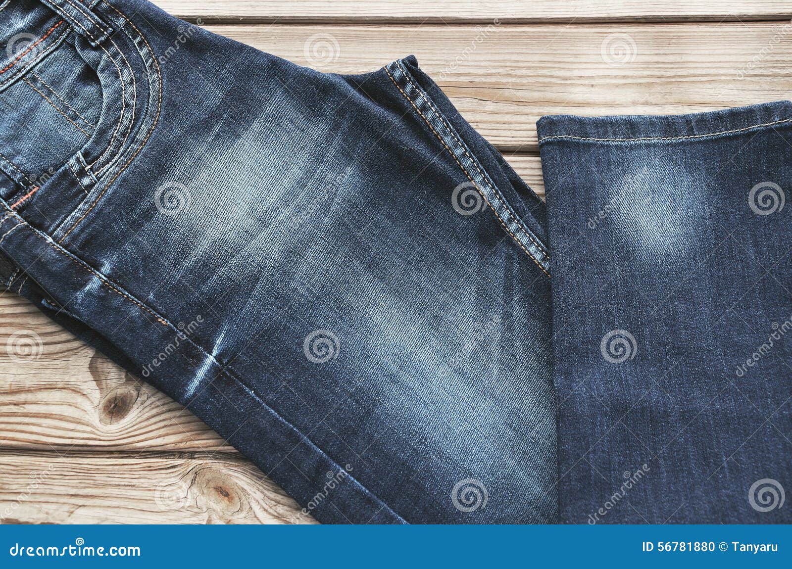 Jeans Diagonally on Wooden Background. Horizontal Stock Photo - Image ...