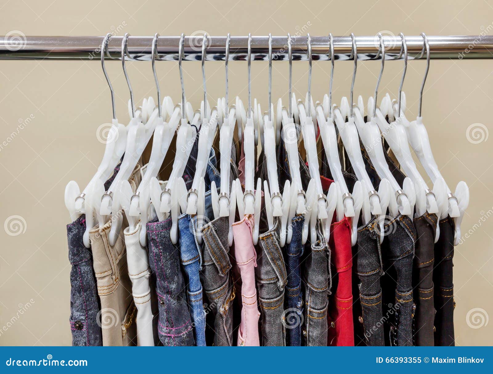 Jeans Hanging in Row on Hanger Stock Image - Image of material, pants ...