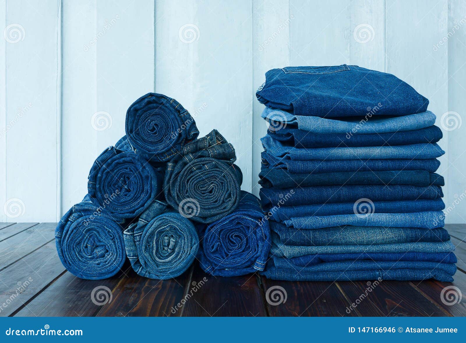 Jeans Stacked on Wooden Floor. Blank Background for Design and Text ...