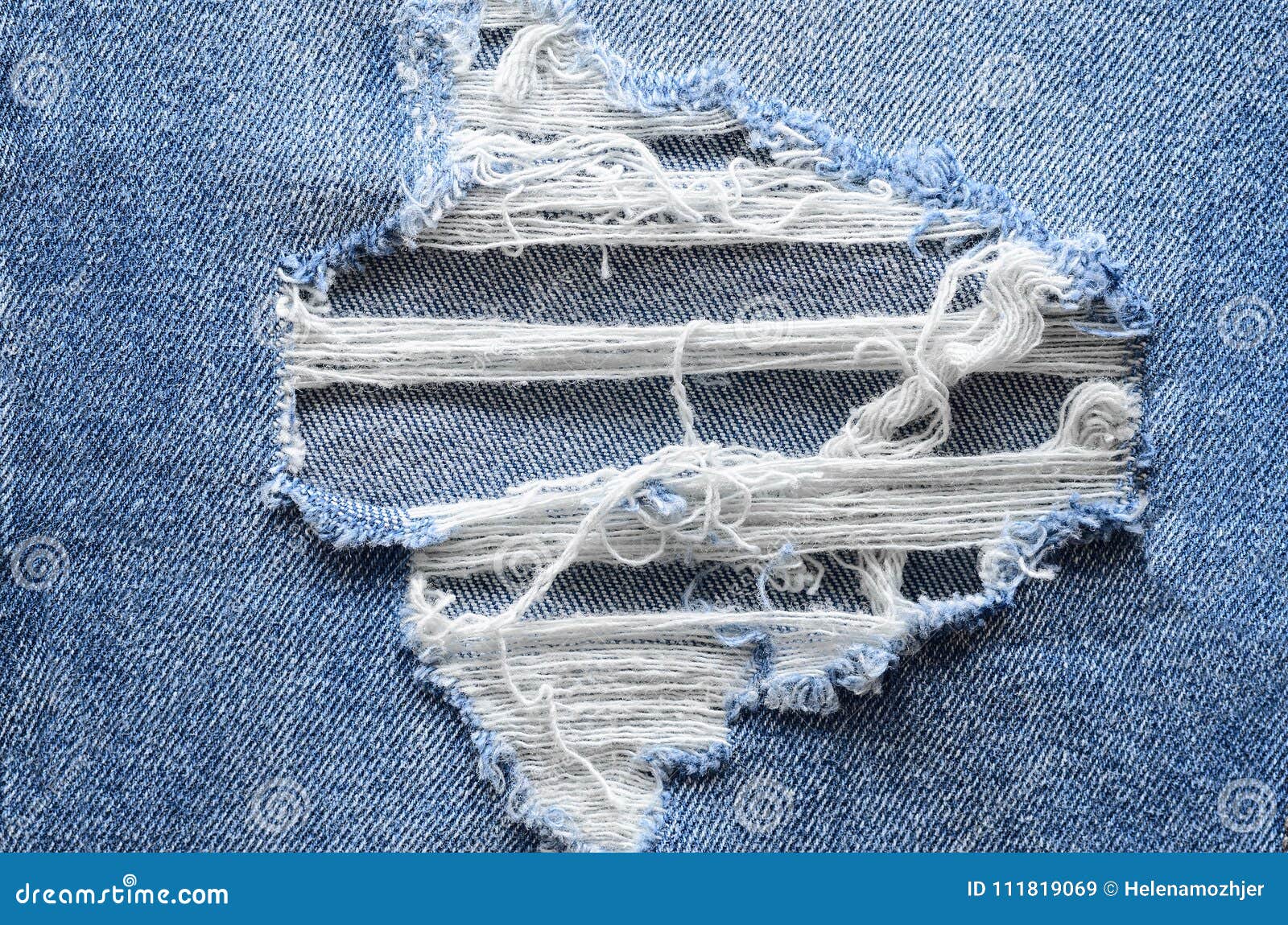 Jeans in Wash Blue with Rip. Denim Background, Texture Stock Image ...