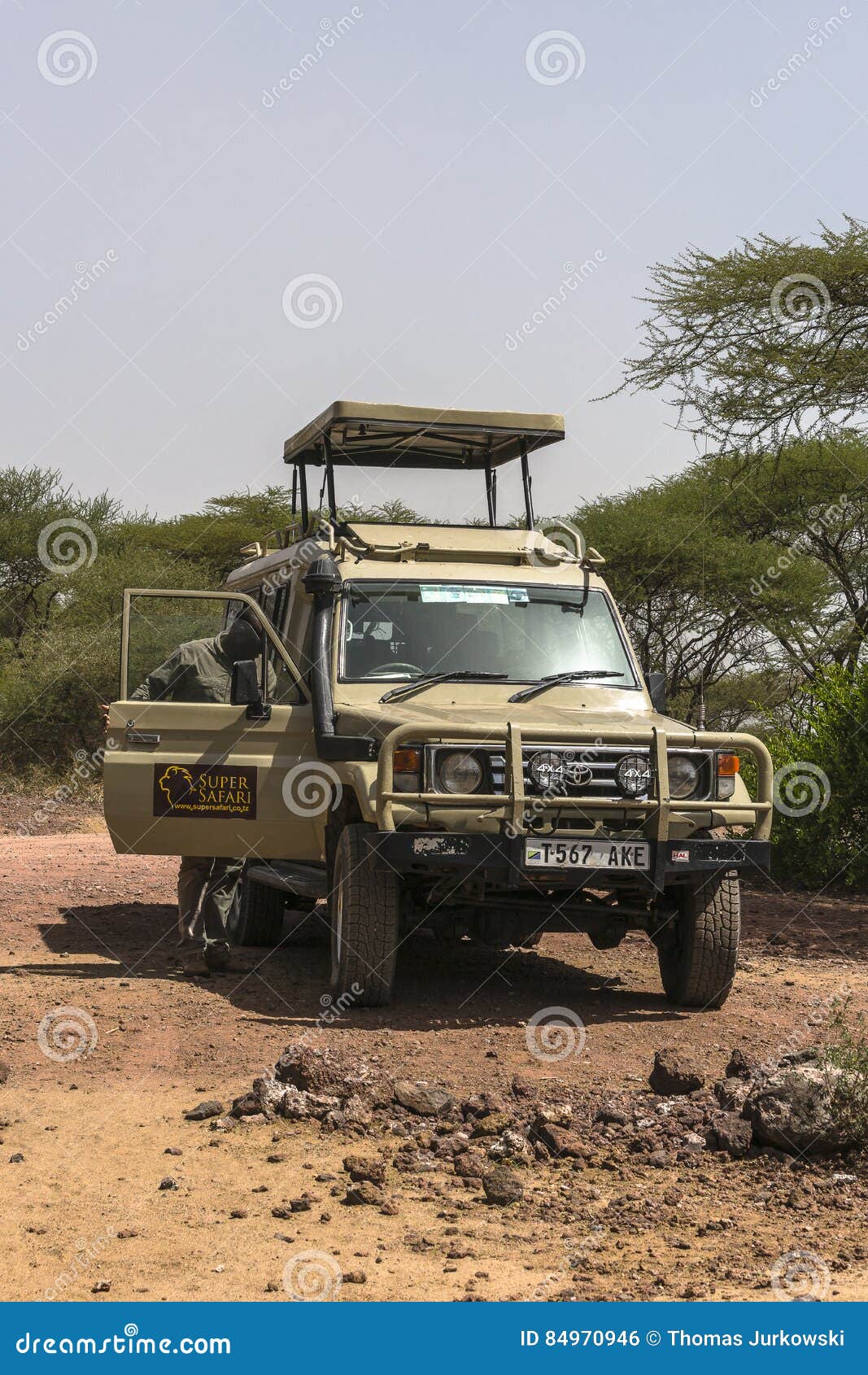 Jeep on Safari editorial photo. Image of jungle, clouds - 84970946