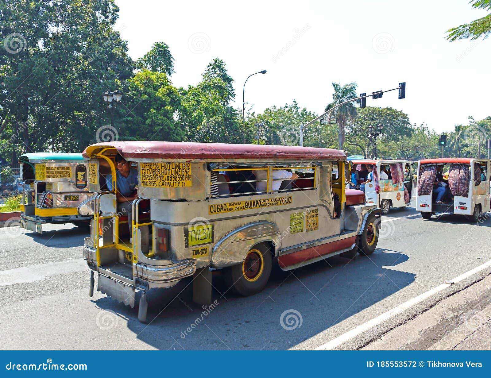 Jeepney on a road of Manila, Philippines. Manila, Philippines - September 24, 2018: Jeepney on a road of Manila is inexpensive bus service. Jeepneys are popular means of public transportation inspired from US military jeeps