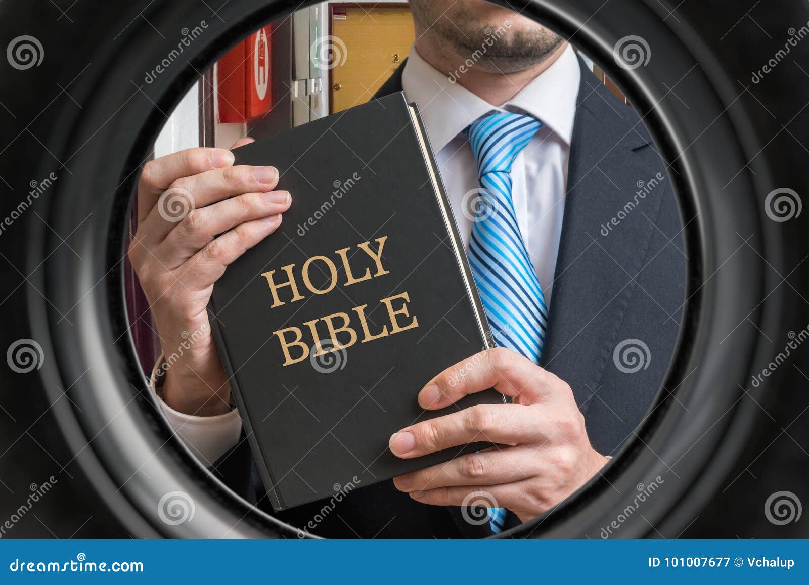 jehovah witness is showing bible behind door. view from peephole