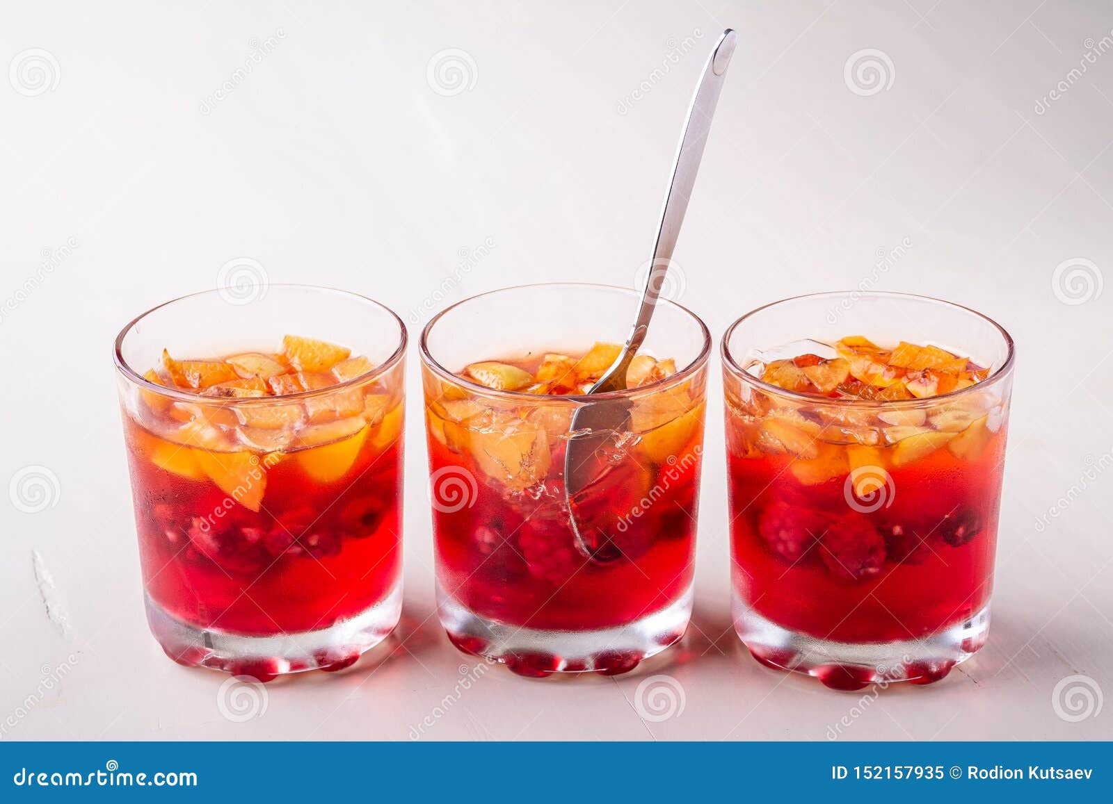 Jelly Dessert With Fruits Apricot Raspberry In Three Drinking Glasses ...