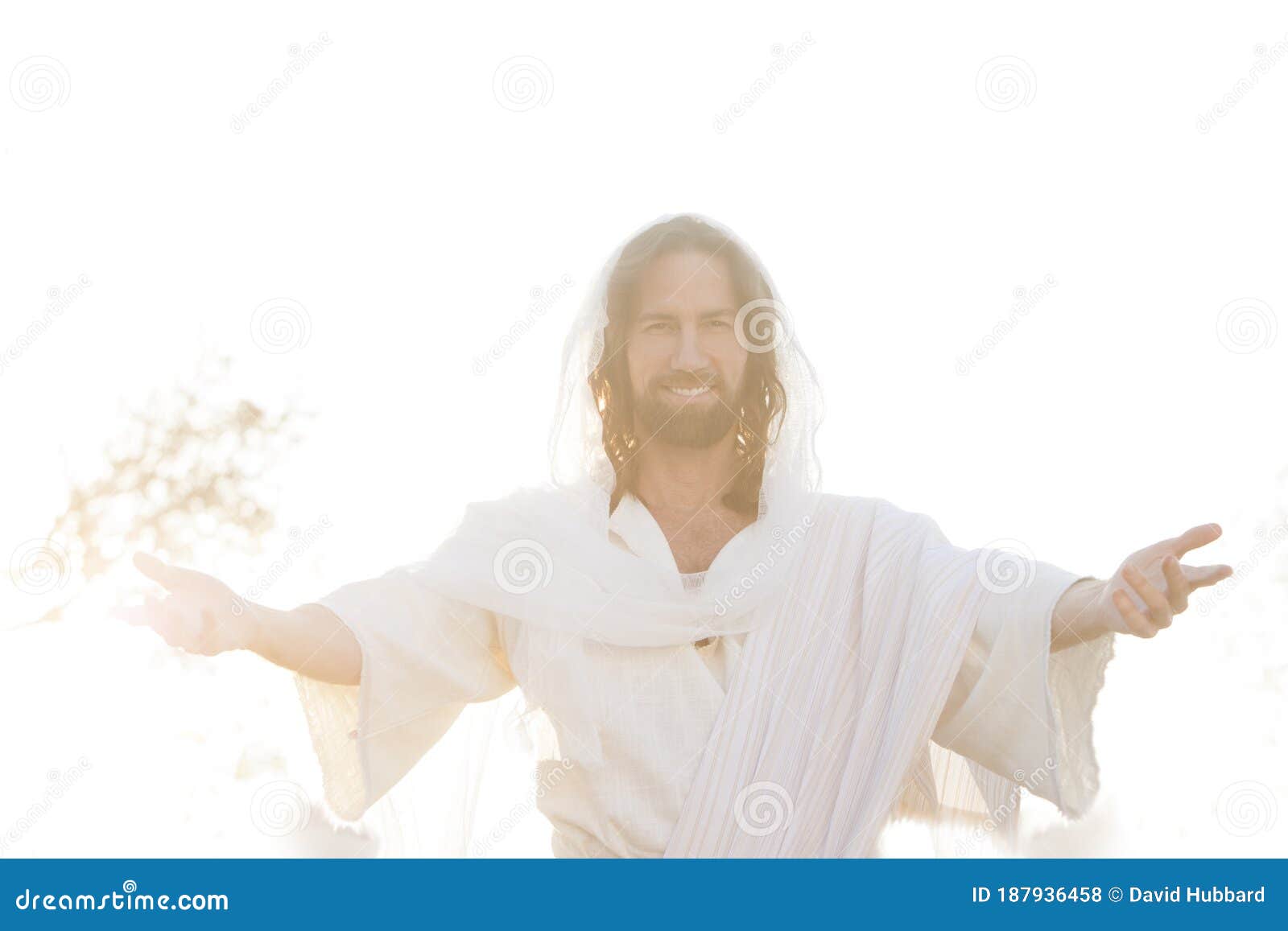 jesus christ smiles from heaven with arms outstretched  in light