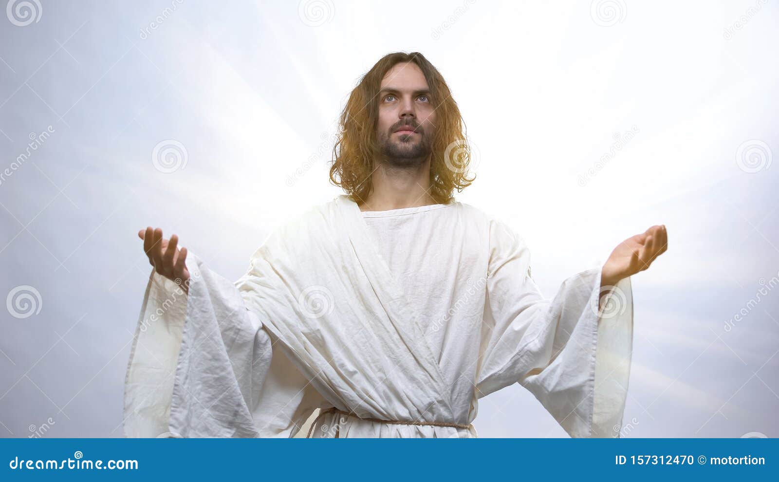 Jesus Raising Hands To Heaven on Illuminated Background ...