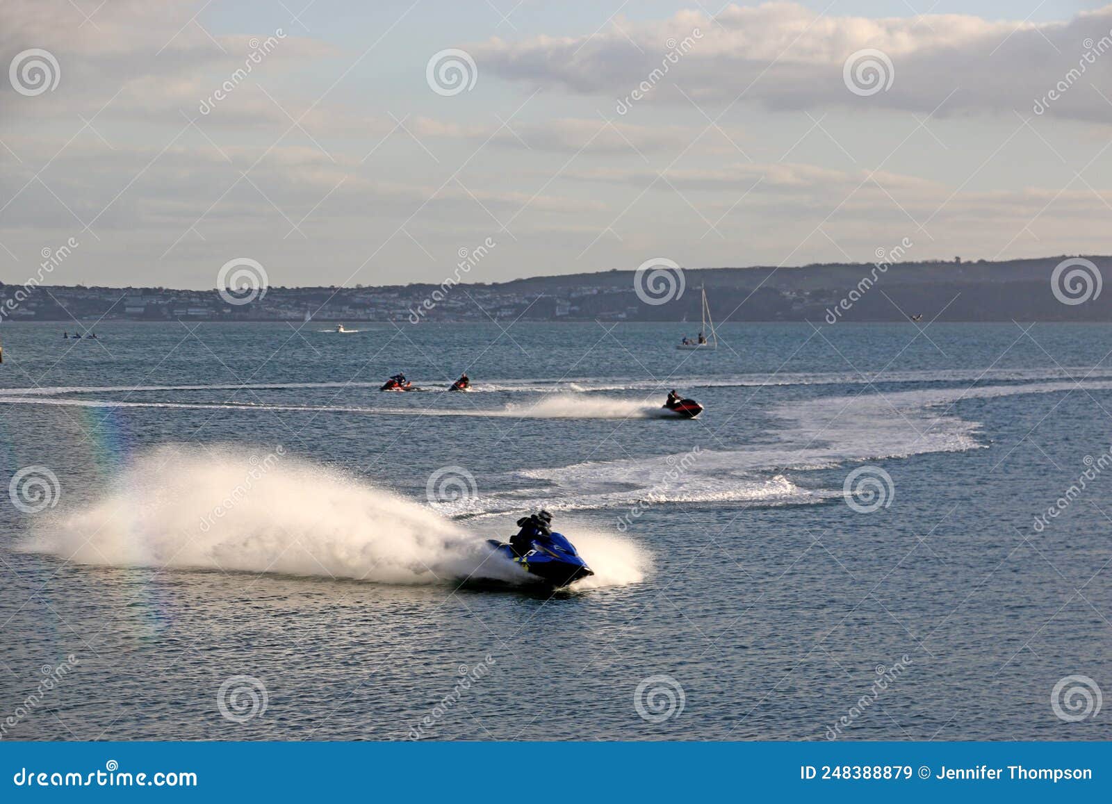 Jet skis in Torbay, Devon stock image. Image of clouds 248388879