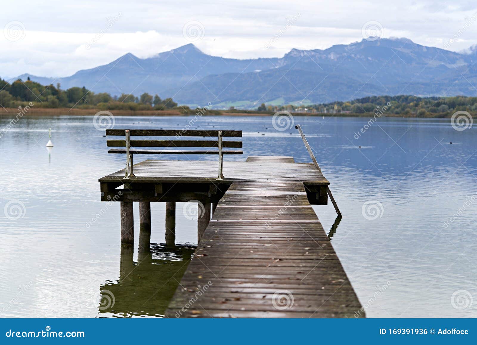 jetty with a bench in a lake of baviera