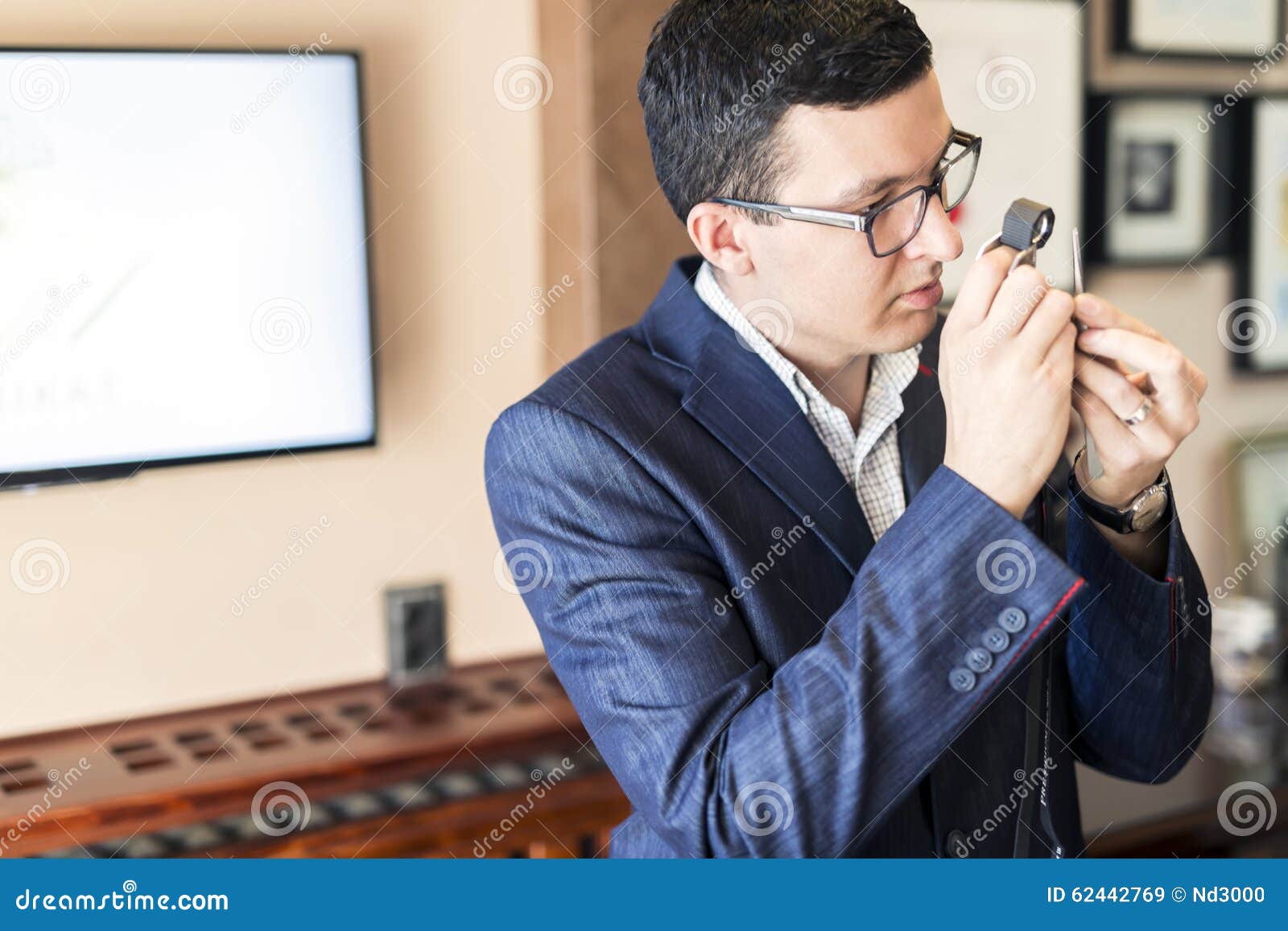 Jeweler Examining Diamond through Loupe Stock Image Image of human