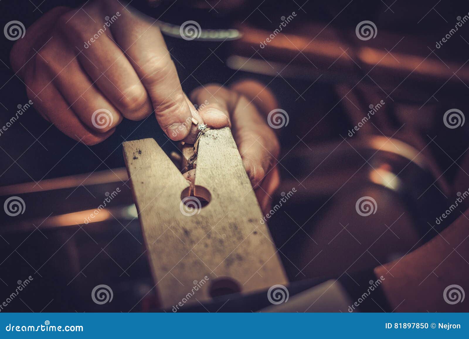 jeweler at work in jewelery workshop