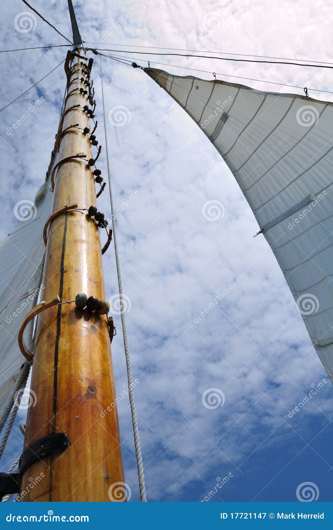 jib and wooden mast of schooner sailboat stock image